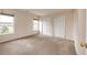Bright bedroom features carpeted floors, dual closets, and natural light from large windows at 3841 Colorful Ln, Castle Rock, CO 80109