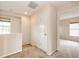 Light-filled hallway with carpeted floors and access to multiple rooms at 3841 Colorful Ln, Castle Rock, CO 80109