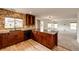 An eat-in kitchen displays wood cabinets and countertops with an adjacent living room at 3841 Colorful Ln, Castle Rock, CO 80109