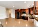 A kitchen boasts granite countertops, dark wood cabinets, and modern black appliances at 3841 Colorful Ln, Castle Rock, CO 80109
