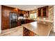 Modern kitchen featuring stainless appliances, granite countertops, custom cabinets and an island at 3841 Colorful Ln, Castle Rock, CO 80109