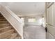 A light-filled living room view from the entry, showing the open floor plan and staircase at 3841 Colorful Ln, Castle Rock, CO 80109