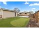 Backyard with detached garage, home and putting green at 1996 S Dexter St, Denver, CO 80222