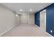 Open basement area with neutral walls and carpeting, ready for customization at 1996 S Dexter St, Denver, CO 80222