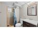 Bathroom with a shower, white fixtures, and nice tile work at 1996 S Dexter St, Denver, CO 80222