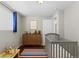 Charming Bedroom featuring a crib, dresser with toys, and bright, colorful accents at 1996 S Dexter St, Denver, CO 80222