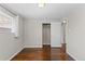 Spacious bedroom with hardwood floors, closet space, and a large window at 1996 S Dexter St, Denver, CO 80222
