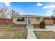 Charming single-story home features a well-maintained front yard, brick accents, and a concrete walkway at 1996 S Dexter St, Denver, CO 80222