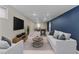 Spacious living room with modern furniture, including a comfortable sofa and chairs at 1996 S Dexter St, Denver, CO 80222