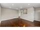 Spacious living room with gleaming hardwood floors, neutral paint, large windows, and recessed lighting at 1996 S Dexter St, Denver, CO 80222