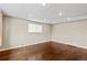 Expansive living room features hardwood floors, neutral paint, large windows, and recessed lighting at 1996 S Dexter St, Denver, CO 80222