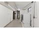 Bright utility room with white walls, concrete floors, and modern washer and dryer at 1996 S Dexter St, Denver, CO 80222