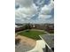 Backyard with a lush lawn, well-maintained landscaping and neighborhood views at 3029 Merlin Dr, Brighton, CO 80601