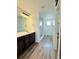 Contemporary bathroom featuring a dual sink vanity and glass shower at 3029 Merlin Dr, Brighton, CO 80601