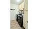 Well-equipped laundry room complete with modern washer and dryer units at 3029 Merlin Dr, Brighton, CO 80601