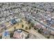 A bird's-eye perspective of the residential area highlights its organized street grid, nearby park, and diverse housing styles at 10825 Mount Antero Way, Parker, CO 80138