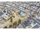 An aerial view showcasing the community layout, with homes nestled among tree-lined streets and open green spaces for recreation at 10825 Mount Antero Way, Parker, CO 80138