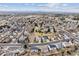 An aerial shot featuring the picturesque neighborhood, expansive plains, winding streets, and mountain views in the distance at 10825 Mount Antero Way, Parker, CO 80138