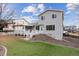 A well-maintained backyard features a covered patio, grassy area, and beautiful landscaping at 10825 Mount Antero Way, Parker, CO 80138