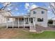 A spacious backyard features a covered patio, grassy area, and landscaping at 10825 Mount Antero Way, Parker, CO 80138