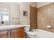 Bathroom featuring a tiled shower and tub combination, neutral walls, and single sink vanity at 10825 Mount Antero Way, Parker, CO 80138