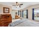 Comfortable main bedroom with vaulted ceilings, natural light, wood furniture, and ceiling fan at 10825 Mount Antero Way, Parker, CO 80138
