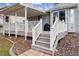 Deck features stairs leading down to the yard, a covered porch, and grey wooden floors at 10825 Mount Antero Way, Parker, CO 80138