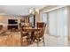 Cozy dining room with hardwood floors, a chandelier, and a wooden dining set, next to living room at 10825 Mount Antero Way, Parker, CO 80138
