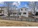 Backyard featuring a fenced-in yard, an attached covered deck, and gray siding on the home at 10825 Mount Antero Way, Parker, CO 80138