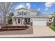 Charming two-story home with a well-manicured front yard and attached two-car garage at 10825 Mount Antero Way, Parker, CO 80138