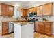 Modern kitchen featuring granite countertops, stainless steel appliances, and custom wood cabinetry at 10825 Mount Antero Way, Parker, CO 80138