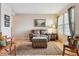 Warm living room with hardwood floors, a comfortable sofa, and a decorative rug at 10825 Mount Antero Way, Parker, CO 80138
