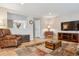 Comfortable living room with hardwood floors, a large television, and stylish furnishings at 10825 Mount Antero Way, Parker, CO 80138