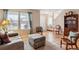 Inviting living room with hardwood floors, large windows, and cozy seating area at 10825 Mount Antero Way, Parker, CO 80138