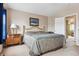 Serene bedroom with neutral walls, a comfortable bed, and ample natural light at 10825 Mount Antero Way, Parker, CO 80138