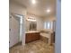 This primary bath offers a large tub, enclosed shower, and dual sink vanity at 8802 E 24Th Pl # 101, Denver, CO 80238