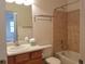 Bathroom with tile bathtub and shower, single sink vanity at 8802 E 24Th Pl # 101, Denver, CO 80238