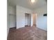 Bedroom with carpet and closet at 8802 E 24Th Pl # 101, Denver, CO 80238