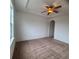 This bedroom features a ceiling fan and archway to another room at 8802 E 24Th Pl # 101, Denver, CO 80238
