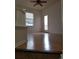 Bonus room with wood floors, an exterior door, and lots of natural light at 8802 E 24Th Pl # 101, Denver, CO 80238