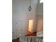 View from the stairs in the foyer with a chandelier, doors, and hardwood floors at 8802 E 24Th Pl # 101, Denver, CO 80238