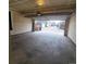 Attached garage with concrete flooring and automatic door at 8802 E 24Th Pl # 101, Denver, CO 80238
