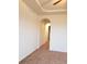 This hallway leads to another room, with matching carpet and white walls at 8802 E 24Th Pl # 101, Denver, CO 80238