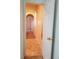 Hallway showcasing white walls and doors plus decorative door hardware at 8802 E 24Th Pl # 101, Denver, CO 80238