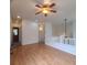 Bright living room with hardwood floors, ceiling fan and access to upstairs at 8802 E 24Th Pl # 101, Denver, CO 80238