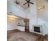Open concept living room with fireplace, open to the kitchen, with stairs to the second level at 8802 E 24Th Pl # 101, Denver, CO 80238