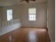 Bright living room with hardwood floors, and large windows at 8802 E 24Th Pl # 101, Denver, CO 80238