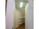 Pantry features corner shelves and overhead lighting in a compact space at 8802 E 24Th Pl # 101, Denver, CO 80238