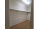 Spacious walk-in closet with neutral carpet and shelving at 8802 E 24Th Pl # 101, Denver, CO 80238