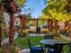 Secluded backyard features a pergola-covered dining area, perfect for outdoor entertaining at 8985 E 29Th Pl, Denver, CO 80238